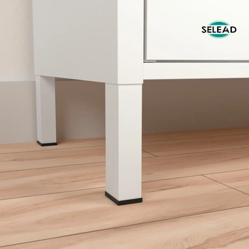 Close-up of high white square steel cabinet legs on wooden floor