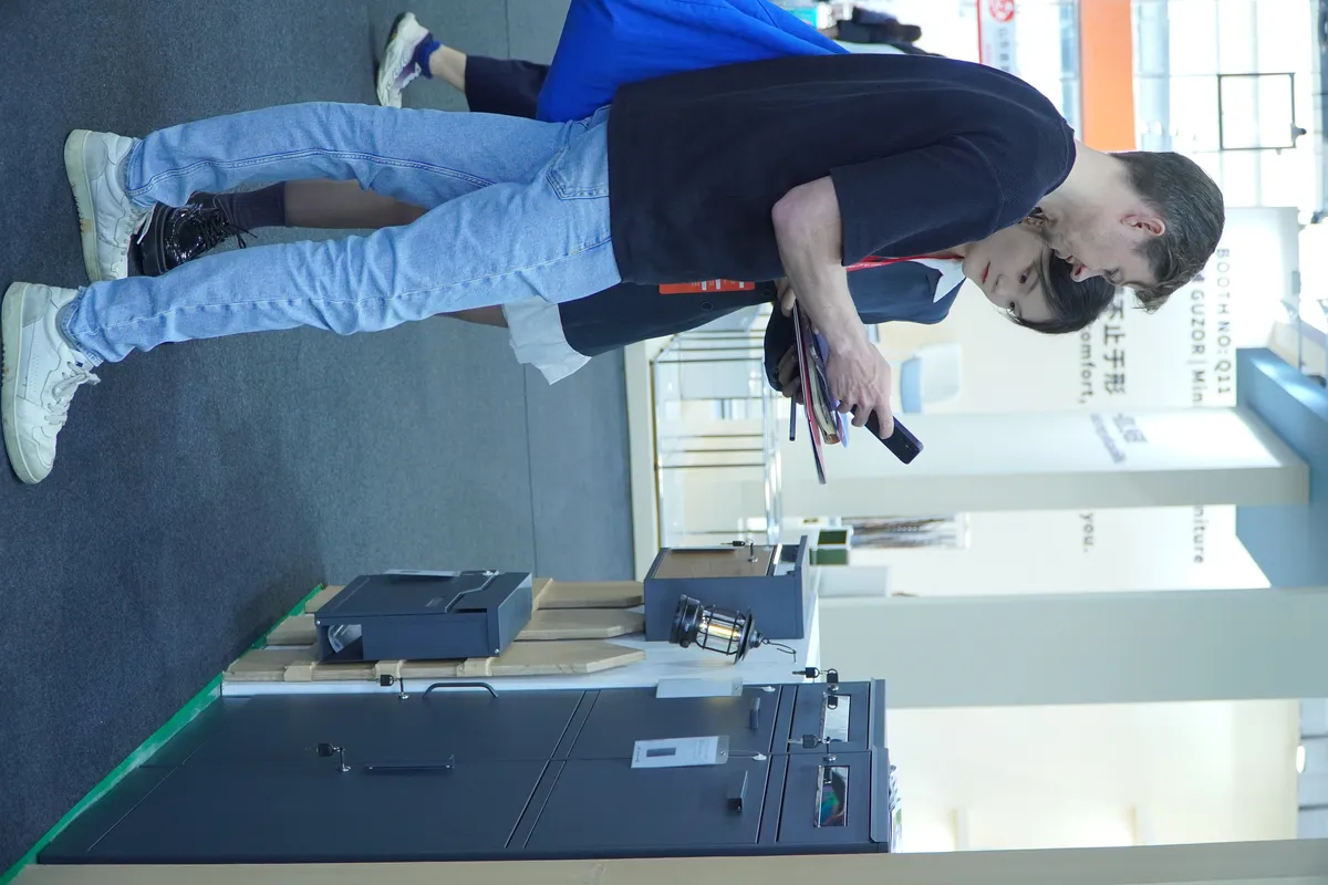 Buyers reviewing mailbox and parcel locker products on display