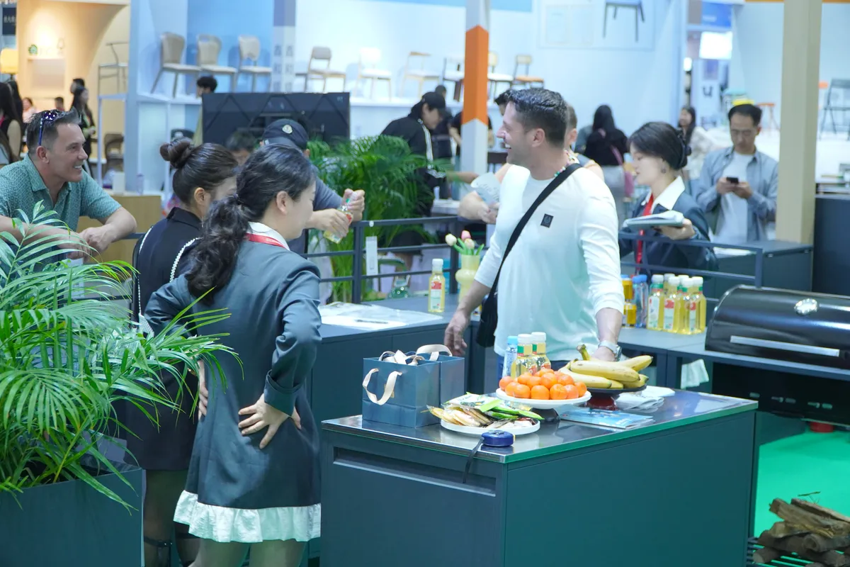 Selead booth interaction scene - international visitors discussing with the sales team